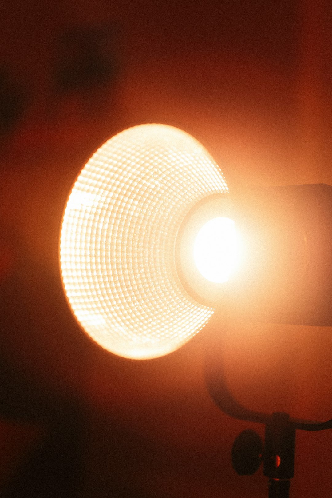 Professional video camera on a tripod in a film studio with softbox lighting